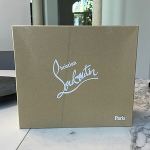 Christian Louboutin Shoe Box, there is a line on top of the box in photo